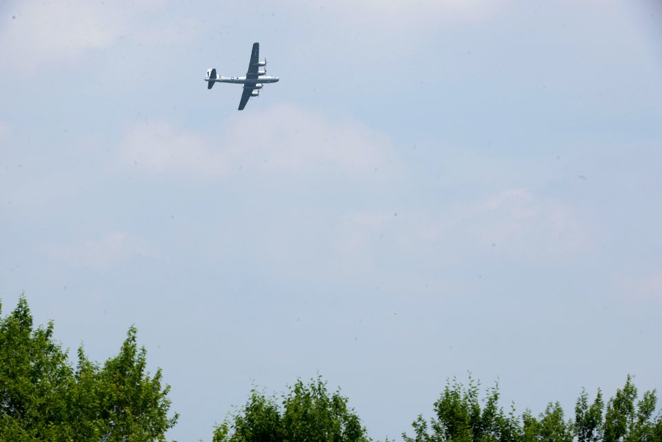 World War II era planes fly over Washington, D.C. seen from Arlington National Cemetery (17243946688)