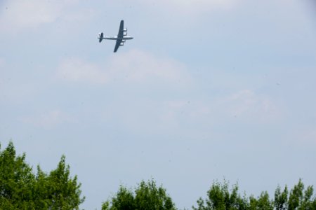 World War II era planes fly over Washington, D.C. seen from Arlington National Cemetery (17243946688)