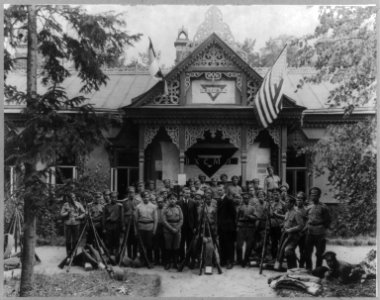 World War I- Russian soldiers with two men (not in uniform) in front of YMCA facility in a Moscow suburb, which was started by Jerome Davis and Wheeler of the American Y.M.C.A. LCCN2005696160