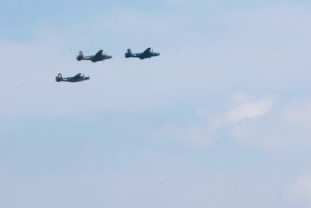 World War II era planes fly over Washington, D.C. seen from Arlington National Cemetery (17429749282)