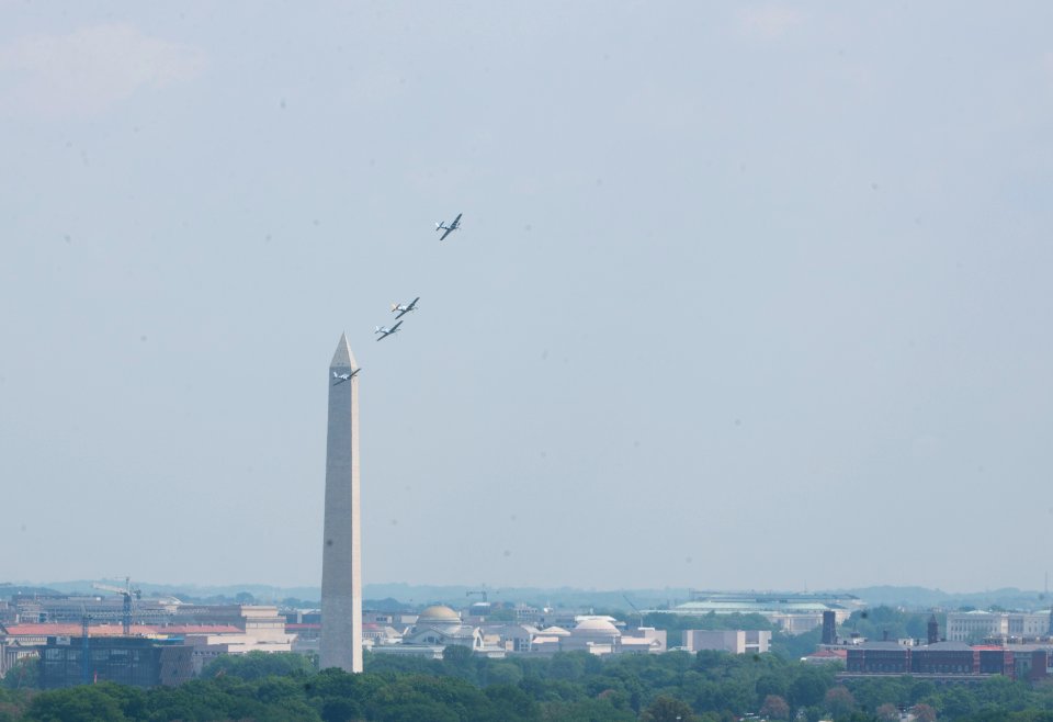 World War II era planes fly over Washington, D.C. seen from Arlington National Cemetery (17245463819)