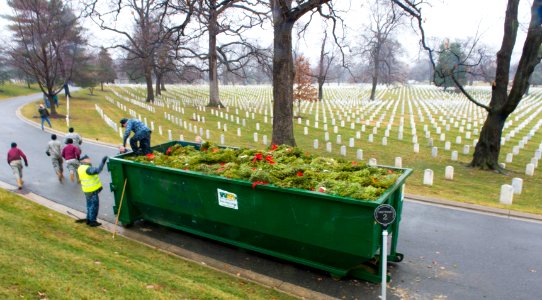 Wreath cleanup event, Full dumpster & headstones (16169462679)