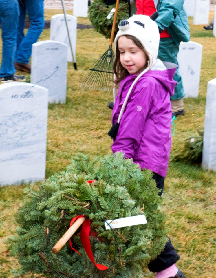 Wreath cleanup event, Little Girl carrying wreaths (16169461059)
