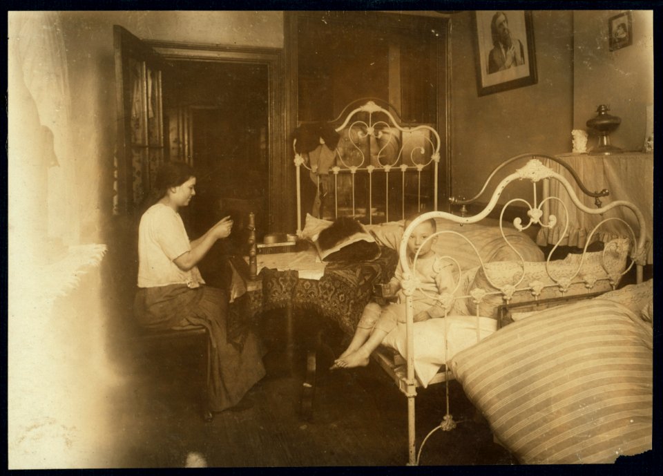 Yetta Leider, making hair-goods for Mowshowitz (of 178 E. 2nd St., N.Y., see photo 2878) 2nd floor front in dirty and ill-kept bed-room at 81 Ridge St., N.Y. Dark kitchen and inner bed-room LOC nclc.04201