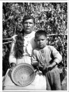 Yokut Indian women basket maker and her son home from school, Tule River Reservation near Porterville, California, ca.1900 (CHS-3798) photo