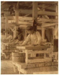Young boy polishing marble in Vermont Marble Co., Centre Rutland, Vt. Most of these are illiterates. LOC nclc.04580