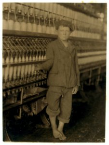 Young doffer boy at machine in Massachusetts Mills, Lindale, Ga. LOC nclc.02789
