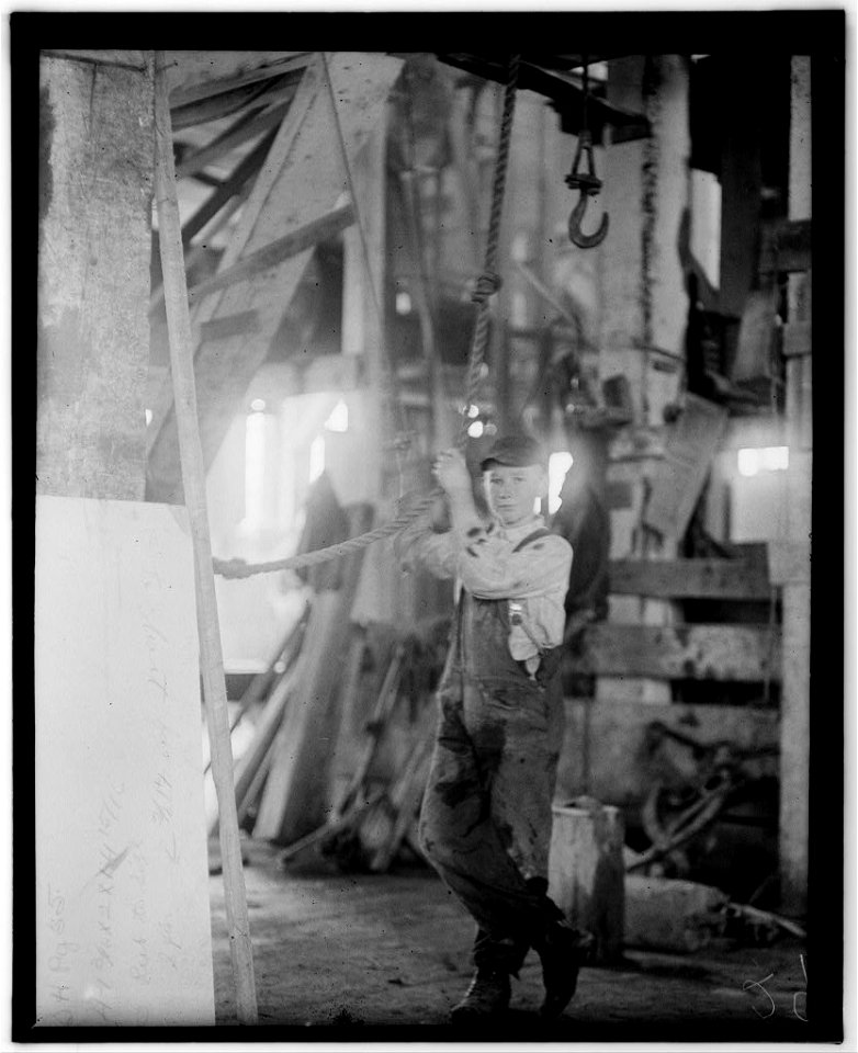 Young boy running machine in Vermont Marble Co., Centre Rutland, Vt. LOC nclc.05283