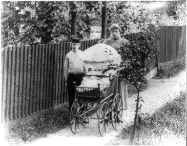 Young boy with girl pushing baby carriage, Staten Island, New York LCCN2011660920