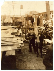 Young boy working for Hickok Lumber Co., Burlington, Vt. LOC nclc.04588