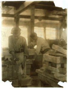 Young boy polishing marble in Vermont Marble Co., Centre Rutland, Vt. Most of these are illiterate. LOC nclc.04591