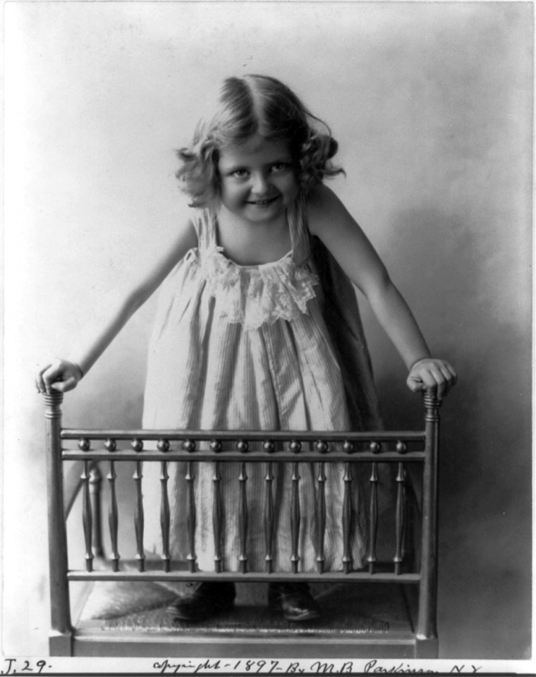 Young girl standing on chair LCCN2002711743