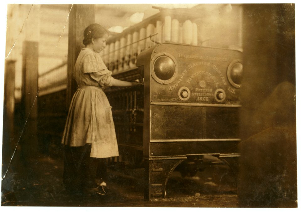 Young girl working in Anniston Yarn Mills. LOC nclc.01926
