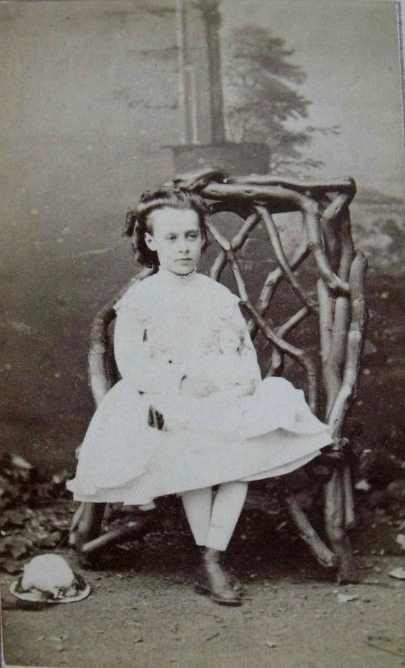 Young girl holding a doll by T & J Holroyd (1)