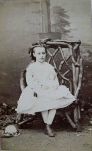 Young girl holding a doll by T & J Holroyd (1)