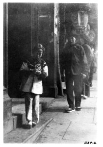 Young girl walking down a street, Chinatown, San Francisco LOC agc.7a09046