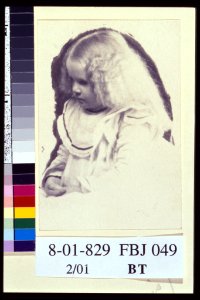 Young fair haired girl seated with hands in her lap) - Huggins, ..., E. 39th St., N.Y LCCN2004676205