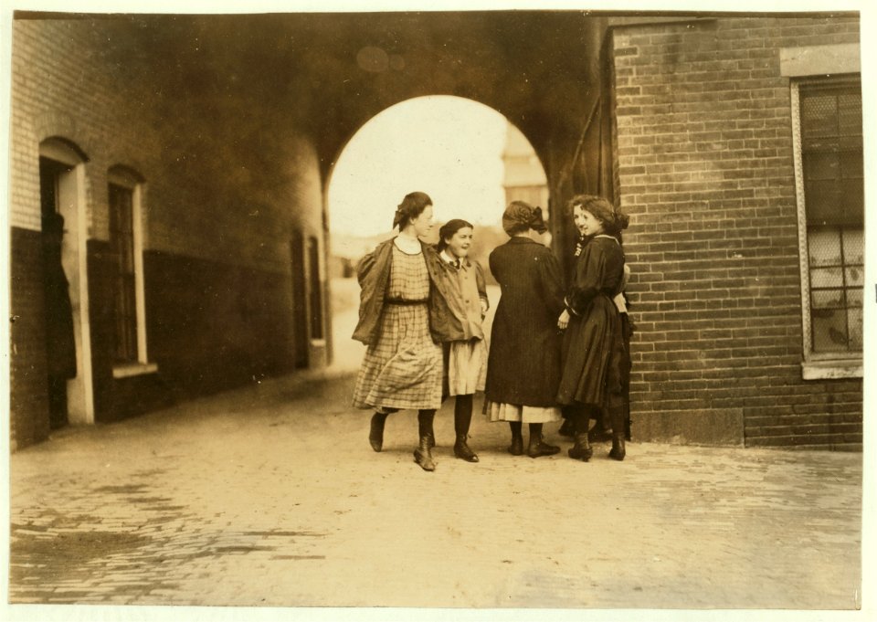 Young girls going to work in Mill No. 1 Cocheco Mfg. Co., Dover, N.H. I saw them go to work regularly, day after day. May 17, 1909-Noon. LOC nclc.01771