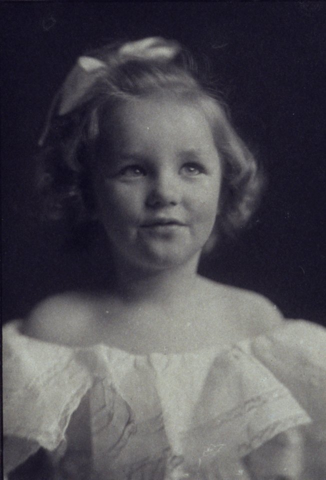 Young girl in a white off-the-shoulder dress with a ribbon in her hair) - Anne Pilsbury LCCN2004676286 (cropped)