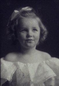 Young girl in a white off-the-shoulder dress with a ribbon in her hair) - Anne Pilsbury LCCN2004676286 (cropped) photo