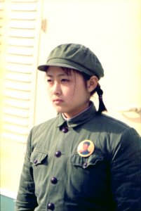 Young girl dressed in soldier attire at the arrival of the press plane in Peking, China - NARA - 194411