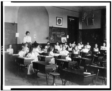 Young girls seated at desks in Washington, D.C. classroom LCCN95500486