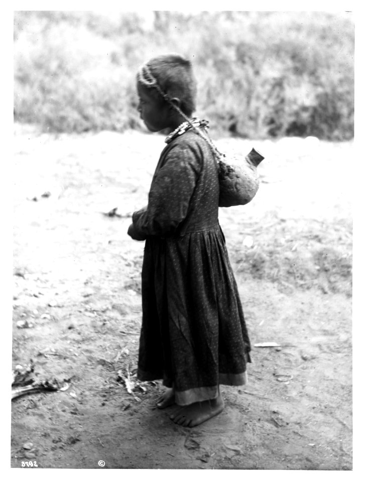 Young Havasupai Indian girl, Waluthama's daughter, carrying an Esna or water bottle, ca.1899 (CHS-3792)
