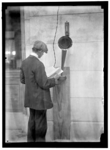 Young man standing near speaker LOC hec.01745 photo