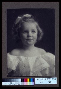 Young girl in a white off-the-shoulder dress with a ribbon in her hair) - Anne Pilsbury LCCN2004676286 photo