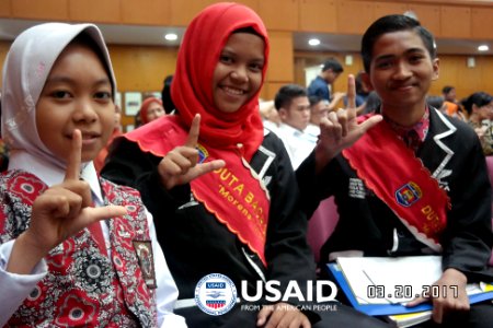 Young literacy ambassadors receive an award from the Minister of Education and Culture. USAID distributes almost 8 million leveled reading books to help schools build a lasting culture of reading. (33858766763)