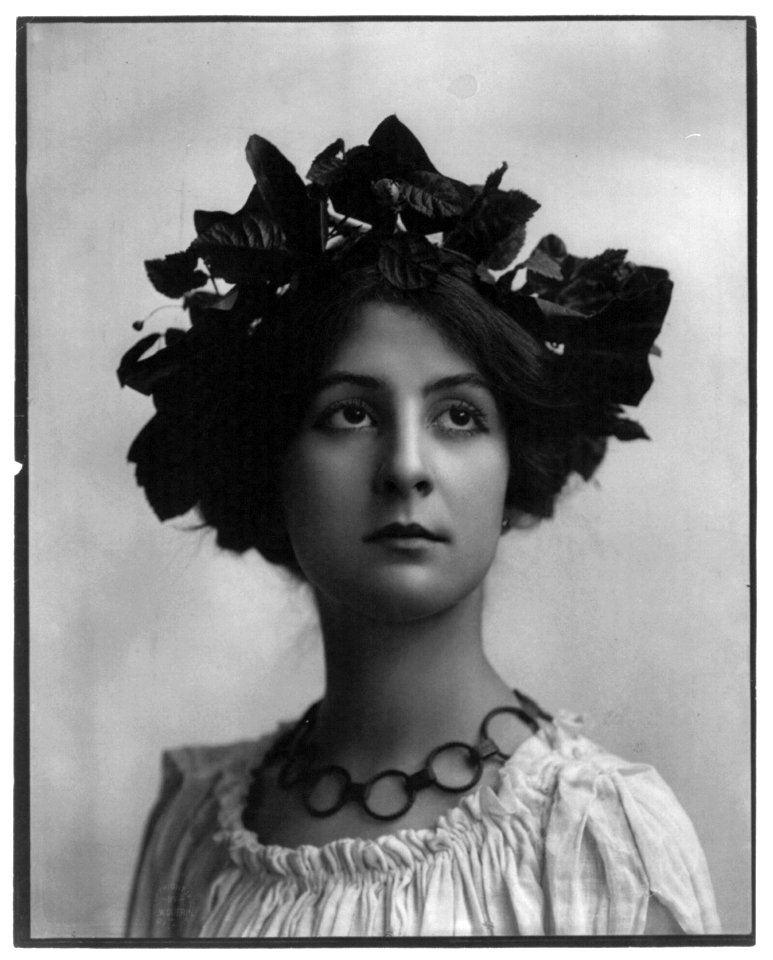 Young woman modeling- Head and shoulders, leaves on head LCCN2003677219