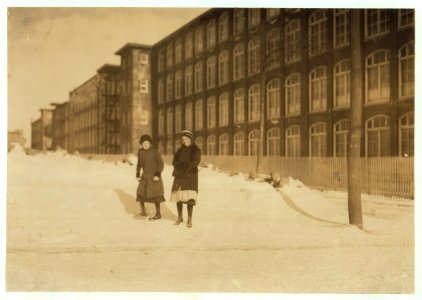 Young workers adolescence and younger in Manomet, Nonquitt and Nashawena Mills. Going to dinner and back to w(o)rk. Noon. January 9, 1912. Richard K. Conant, Witness. LOC nclc.02507