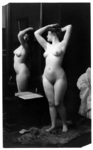 Young woman modeling- full lgth., nude, looking in mirror LCCN2003677215