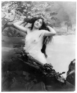 Young woman modeling- nude with garland of flowers LCCN2003677232