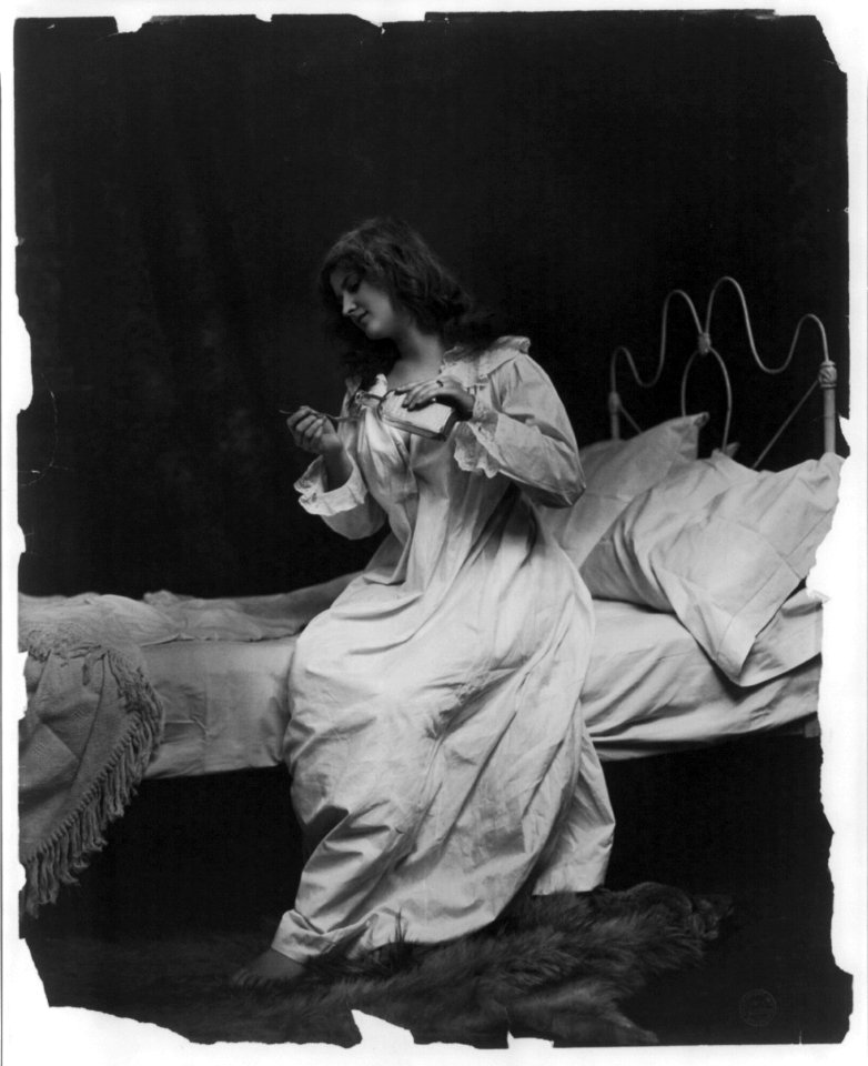 Young women modeling- pouring spoon of medicine LCCN2003677239