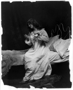 Young women modeling- pouring spoon of medicine LCCN2003677239