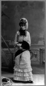 Young woman of the cast of Gilbert & Sullivan's H.M.S. Pinafore, posed against a painted backdrop LCCN2000569609