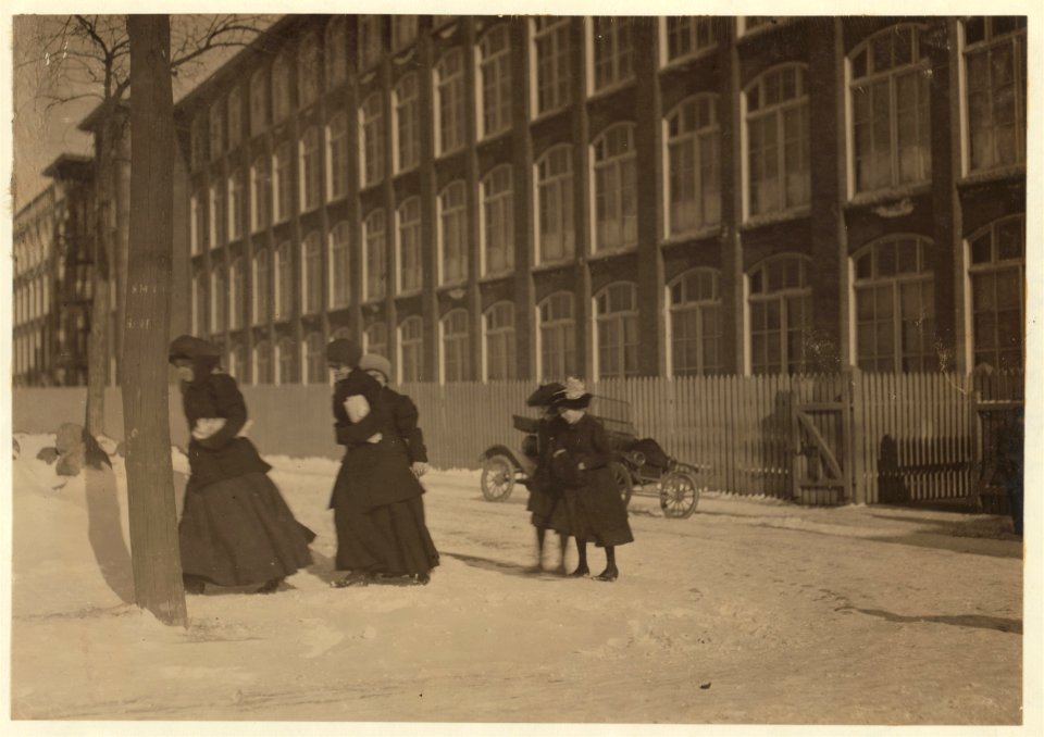 Young workers adolescence and younger in Manomet, Nonquitt and Nashawena Mills. Going to dinner and back to wrk. Noon. January 9, 1912. Richard K. Conand, witness. LOC nclc.02510