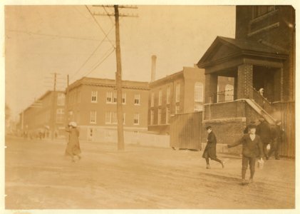 Young workers adolescence and younger in Manomet, Nonquitt and Nashawena Mills. Going to dinner and back to wrk. Noon. January 9, 1912. Richard K. Conant, witness. LOC nclc.02512