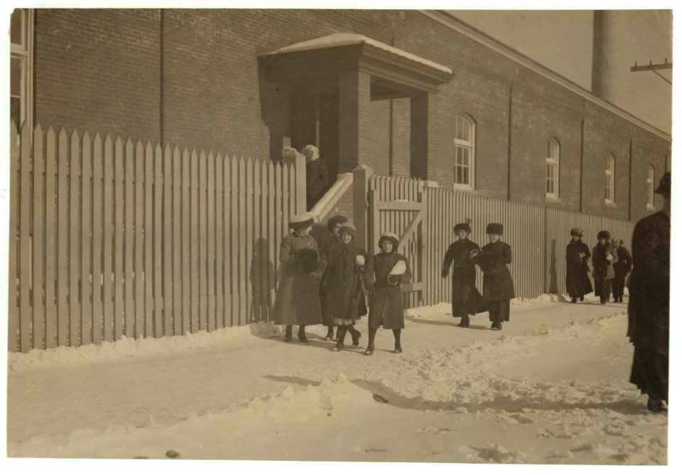 Young workers adolescence and younger in Manomet, Nonquitt and Nashawena Mills. Going to dinner and back to wrk. Noon. January 9, 1912. Richard K. Conant, Witness. LOC nclc.02508