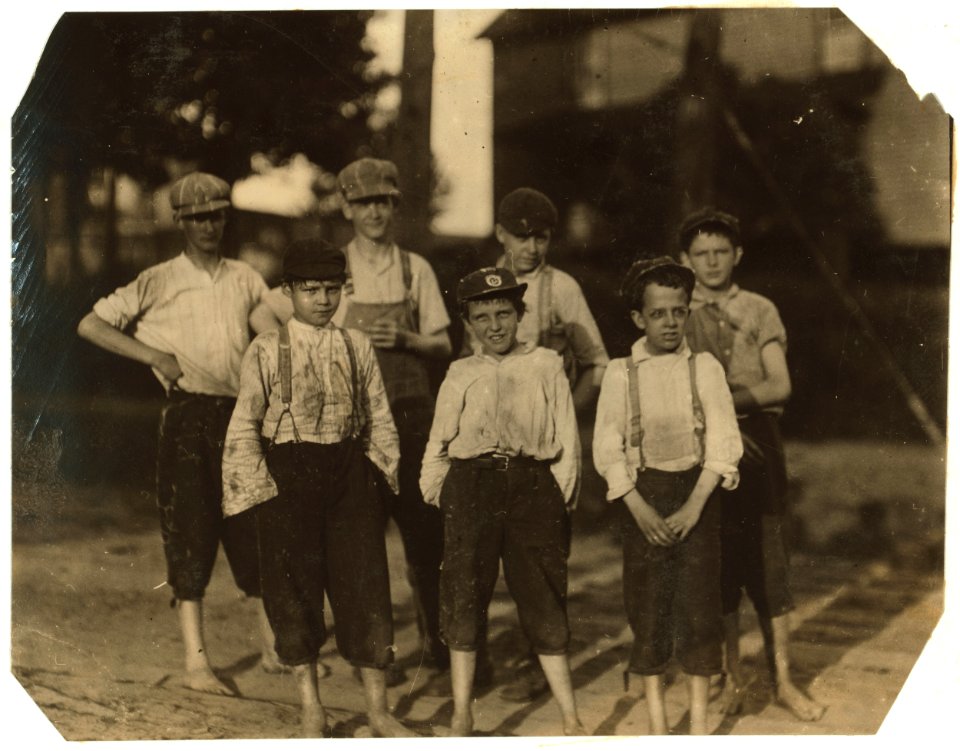 Young workers going home from the Beaumont Mill, Spartenberg (sic), S.C. In the front row are Jesse Farmer, makes 60 cents a day, been working here six months. Haskel Holt, 70 cents a day LOC nclc.02552