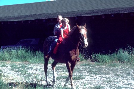 Young women riding a horse photo
