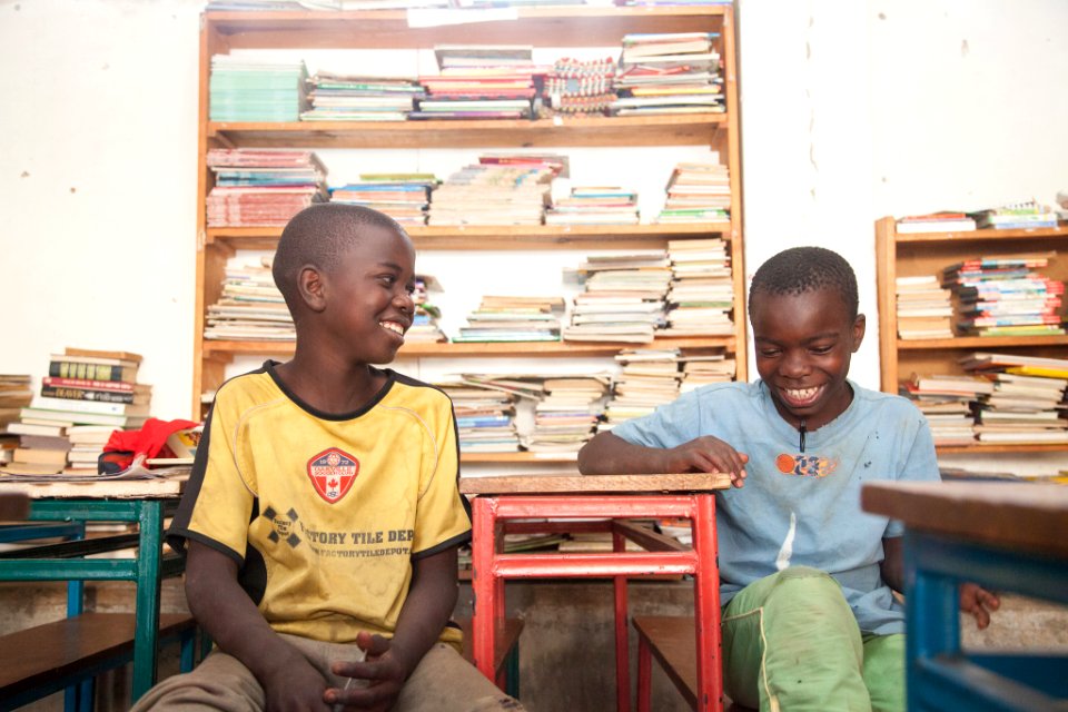 Zambian Boys Reading and Laughing (15349199369)
