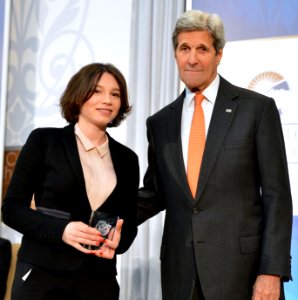 Zhanna Nemtsova of Russia and U.S. Secretary of State John Kerry - IWOC 2016 photo