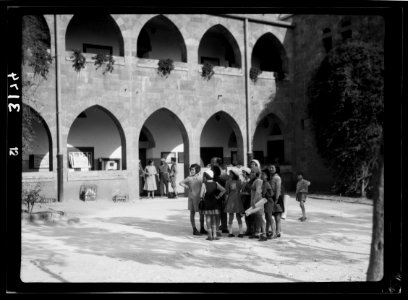 Zionist activities around Haifa. Haifa, a primary school. Using a picturesque old Arab bld'g (i.e., building) LOC matpc.15204