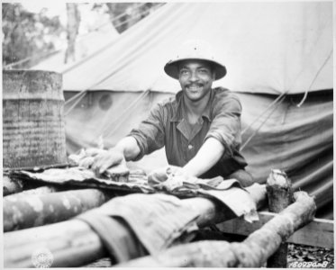 ... American Army Engineer task force in Liberia find themselves in a land from which their ancestors came. Wash day an - NARA - 531144