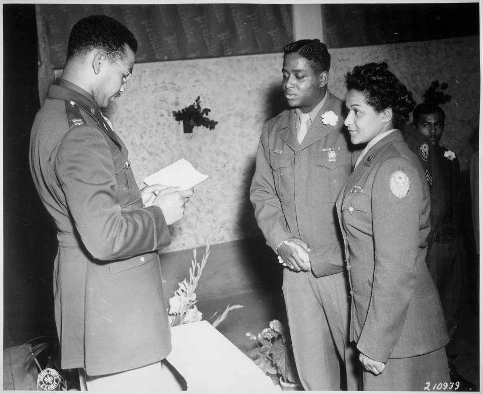 Chaplain William T. Green reads the benediction at the marriage ceremony of Pfc. Florence A. Collins, a WAC of the 6888 - NARA - 531314