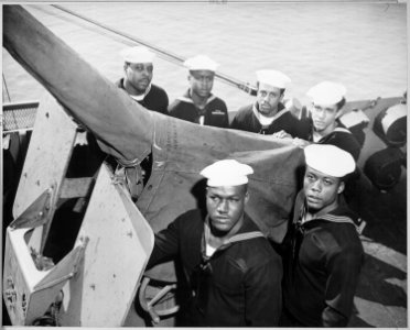 A gun crew of six Negroes who were given the Navy Cross for standing by their gun when their ship was damaged by enemy - NARA - 520688