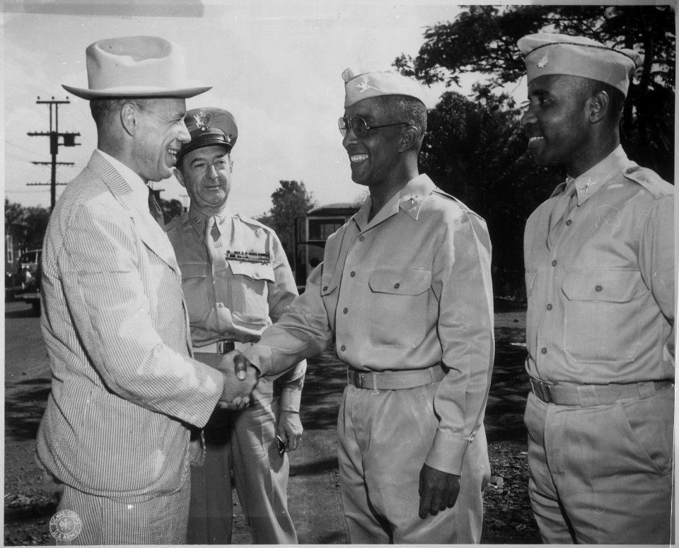 After inspecting a regiment of Negro artillerymen during a visit to Hawaii, Under Secretary of War Robert P. Patterson - NARA - 524377