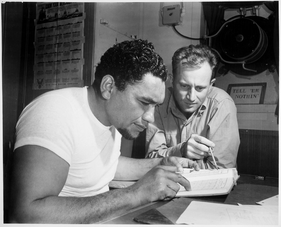 Aboard a Victory ship en route to the Pacific war zone, Chief Mate Earl Stanfield coaches Bos'n Maxie Weisbarth (with w - NARA - 542399